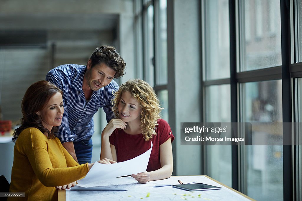 Group of architects discussing projects