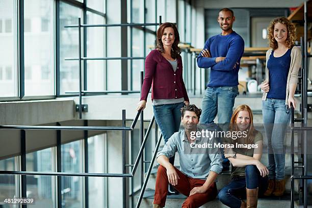 portrait of group of creative business people - stairs business stockfoto's en -beelden