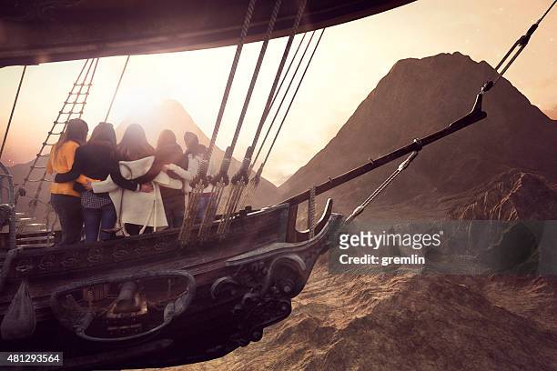 group of friendly flying on the airship over fantasy landscape - airship stock pictures, royalty-free photos & images