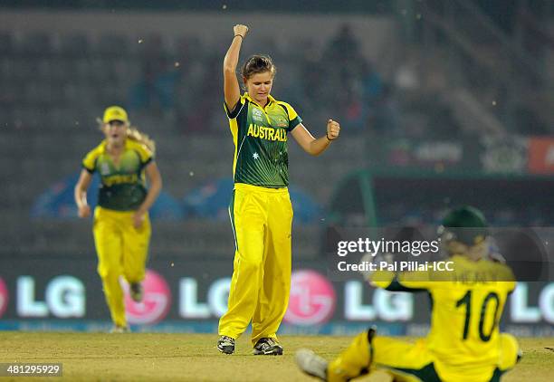 Jess Jonassen of Australia celebrates the wicket of Asmavia Iqbal of Pakistan during the ICC Women's world twenty20 match between Australia Women and...