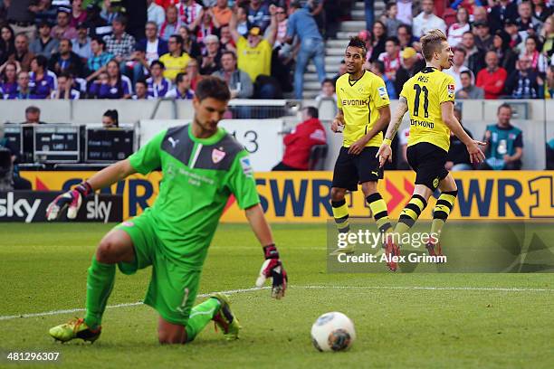 Marco Reus of Dortmund celebrates his team's third goal with team mate Pierre-Emerick Aubameyang as goalkeeper Sven Ulreich of Stuttgart reacts...