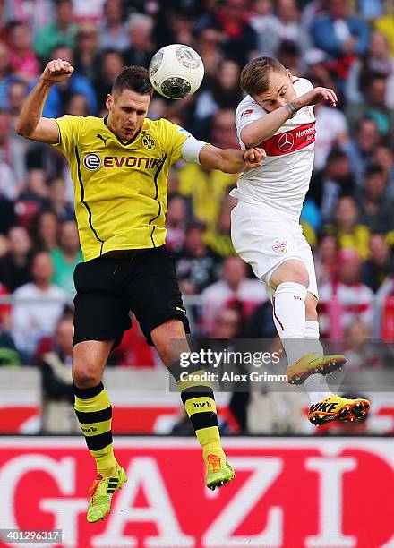 Sebastian Kehl of Dortmund jumps for a header with Alexandru Maxim of Stuttgart during the Bundesliga match between VfB Stuttgart and Borussia...