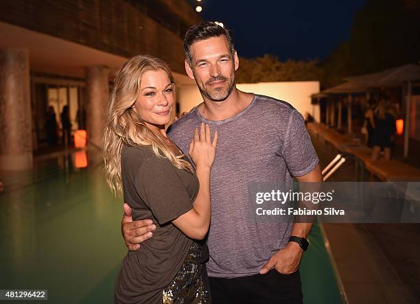 Eddie Cibrian and Singer LeAnn Rimes attend the Maxim Magazine Worldwide Swimwear Collection launch at SLS South Beach on July 18, 2015 in Miami,...