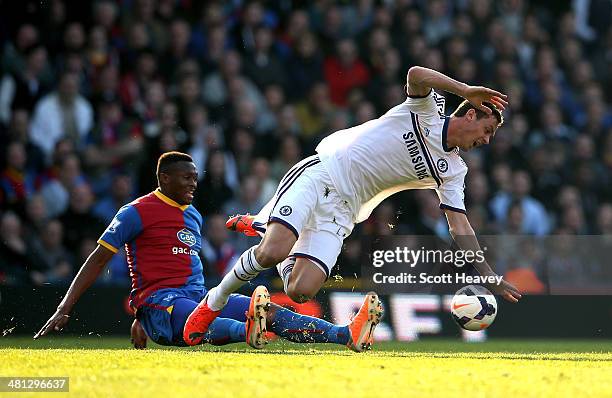 Nemanja Matic of Chelsea is brought down by Kagisho Dikgacoi of Crystal Palace during the Barclays Premier League match between Crystal Palace and...