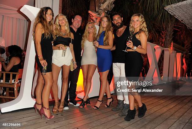 Guests attend the Maxim Magazine Worldwide Swimwear Collection launch at SLS South Beach on July 18, 2015 in Miami, Florida.