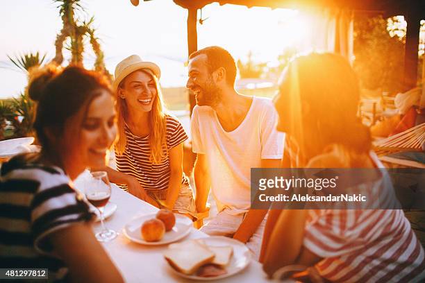 seaside dinner party - evening meal stock pictures, royalty-free photos & images