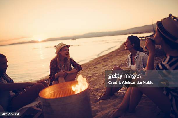 summertime party by campfire - tropische muziek stockfoto's en -beelden
