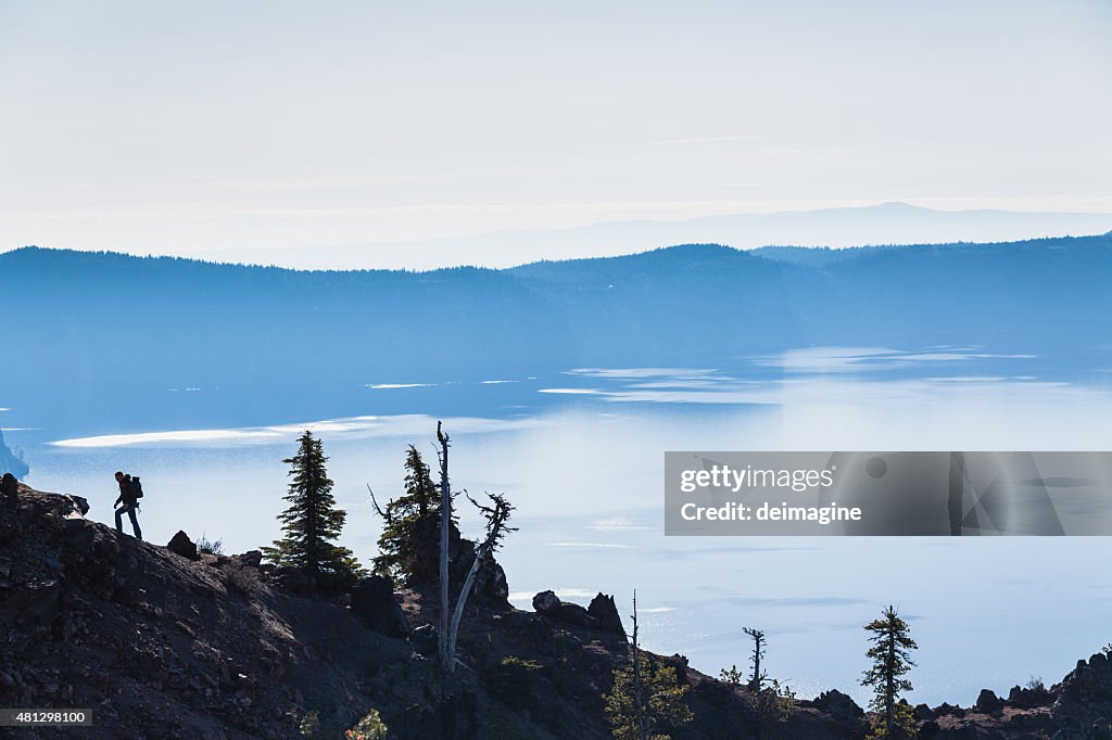 Hiker explores the Crater Lake in Oregon.