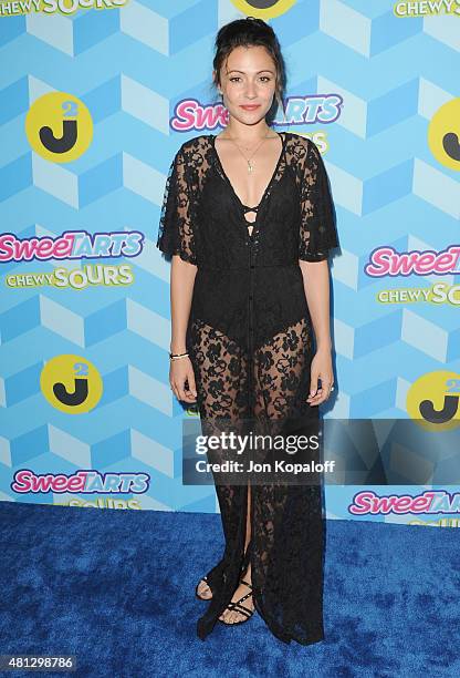 Actress Italia Ricci arrives at Just Jared's Summer Bash Pool Party 2015 on July 18, 2015 in Los Angeles, California.
