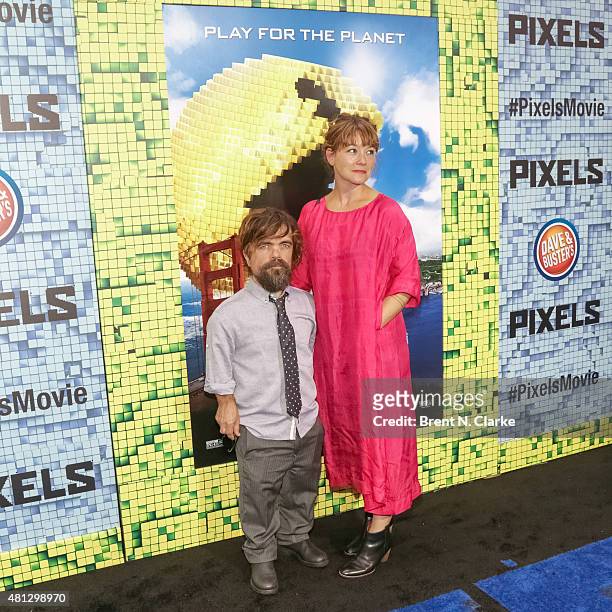 Actor Peter Dinklage and wife Erica Schmidt arrive at the "Pixels" New York premiere held at the Regal E-Walk on July 18, 2015 in New York City.