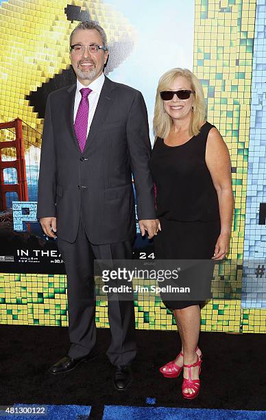Executive producer Michael Barnathan and wife attend the "Pixels" New York premiere at Regal E-Walk on July 18, 2015 in New York City.