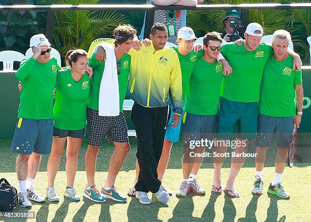 The Australian team including Sam Groth, Thanasi Kokkinakis and Nick Kyrgios look on as teammate Lleyton Hewitt of Australia leaves the court after...