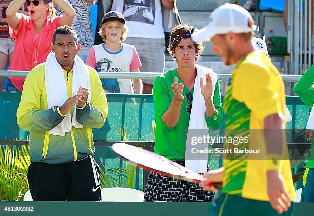 Nick Kyrgios of Australia and Thanasi Kokkinakis of Australia show their support during the reverse singles match between Lleyton Hewitt of Australia...