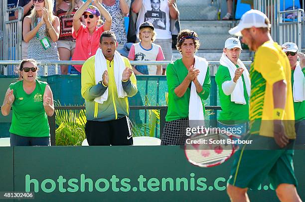 Nick Kyrgios of Australia and Thanasi Kokkinakis of Australia show their support during the reverse singles match between Lleyton Hewitt of Australia...