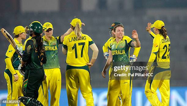 Sarah Coyte of Australia celebrates the wicket of Sidra Amin of Paksitan during the ICC Women's world twenty20 match between Australia Women and...