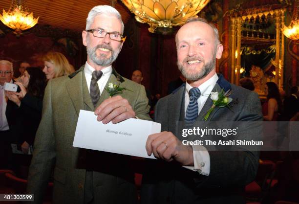 Gay couple Neil Allard and Andrew Wale show off their marriage certificate following their marriage, outside Brighton's Royal Pavilion shortly after...