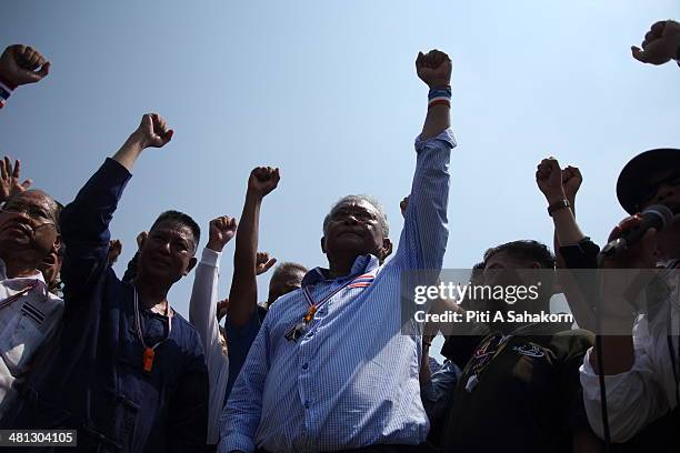 Anti-government leader Suthep Thaugsuban and his supporters cheer during a rally at the Royal Plaza in Bangkok. Tens of thousands of anti-government...