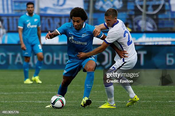 Axel Witsel of FC Zenit St. Petersburg vies for the ball with Igor Denisov of FC Dinamo Moscow during the Russian Football League match between FC...