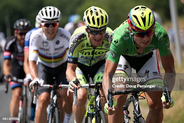 Peter Sagan of Slovakia riding for Tinkoff-Saxo in the green points leader jersey puts pressure on at the front of the breakaway as he is followed by...