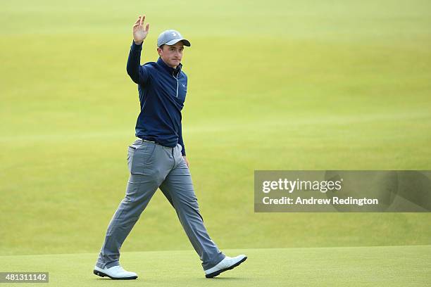 Amateur Paul Dunne of Ireland waves to the crowd on the 18th green during the third round of the 144th Open Championship at The Old Course on July...