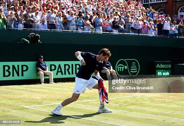 Andy Murray of Great Britain celebrates defeating Gilles Simon of France on Day Three of The World Group Quarter Final Davis Cup match between Great...