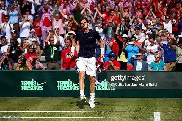 Andy Murray of Great Britain celebrates after defeating Gilles Simon of France on Day Three of The World Group Quarter Final Davis Cup match between...