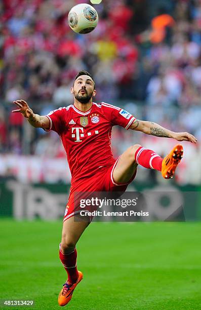 Diego Contento of Muenchen in action during the Bundesliga match between FC Bayern Muenchen and 1899 Hoffenheim at Allianz Arena on March 29, 2014 in...