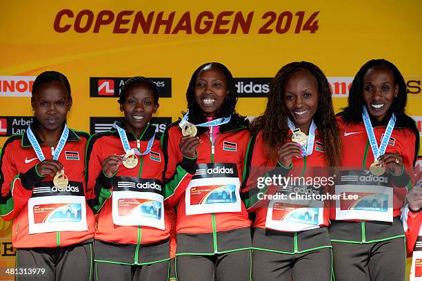 The Women's team of Kenya celebrate with their gold medals during the IAAF/Al-Bank World Half Marathon Championships on March 29, 2014 in Copenhagen,...