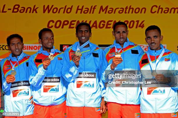 The Men's team of Eritrea celebrate with their gold medals during the IAAF/Al-Bank World Half Marathon Championships on March 29, 2014 in Copenhagen,...