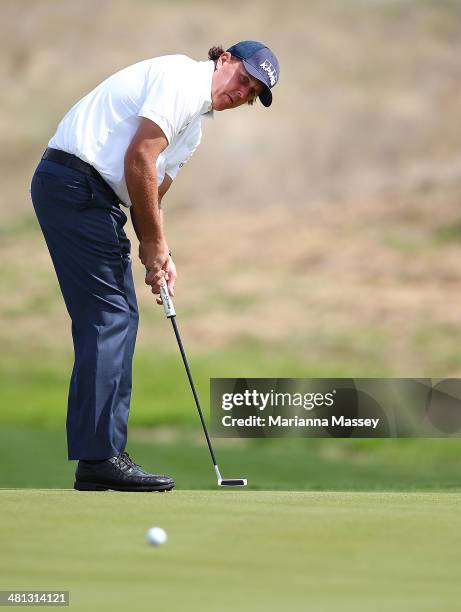 Phil Mickelson putts on the 10th during Round Three of the Valero Texas Open at TPC San Antonio AT&T Oaks Course on March 29, 2014 in San Antonio,...