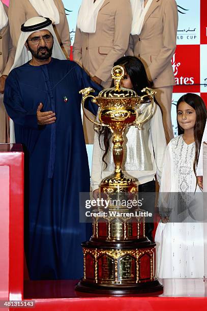 Sheikh Mohammed bin Rashid Al Maktoum, Ruler of Dubai and Vice President of the UAE rejoices after winning the Dubai World Cup with his horse African...