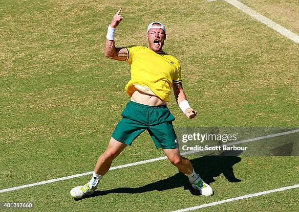 Sam Groth of Australia celebrates match point after winning the reverse singles match between Sam Groth of Australia and Mikhail Kukushkin of...