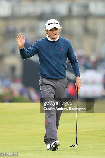 Eddie Pepperell of England waves to the crowd as he walks onto the 16th green during the third round of the 144th Open Championship at The Old Course...