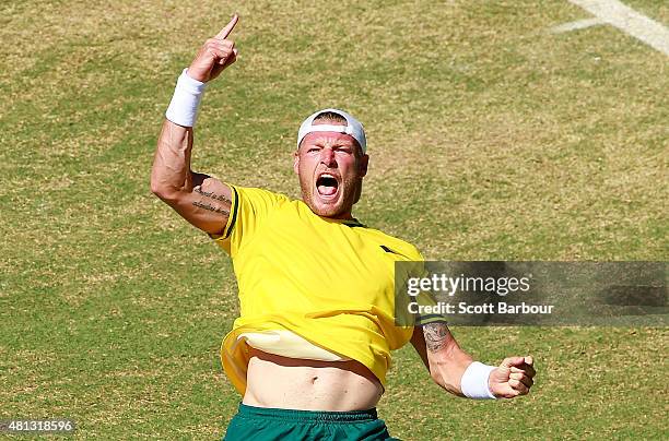 Sam Groth of Australia celebrates match point after winning the reverse singles match between Sam Groth of Australia and Mikhail Kukushkin of...