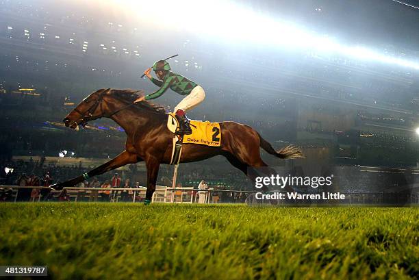 Yuichi Fukunaga celebrates riding Just A Way to victory in the Dubai Duty Free during the Dubai World Cup at the Meydan Racecourse on March 29, 2014...