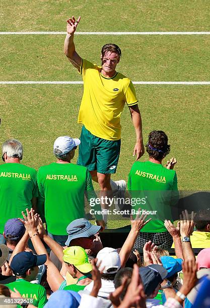Sam Groth of Australia celebrates match point after winning the reverse singles match between Sam Groth of Australia and Mikhail Kukushkin of...