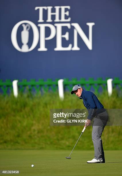 Ireland's amateur golfer Paul Dunne putts on the 18th green during his third round 66, on day four of the 2015 British Open Golf Championship on The...