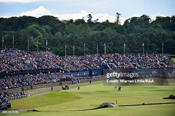 General view is seen as fans watch play from a grandstand on the 17th tee during the third round of the 144th Open Championship at The Old Course on...