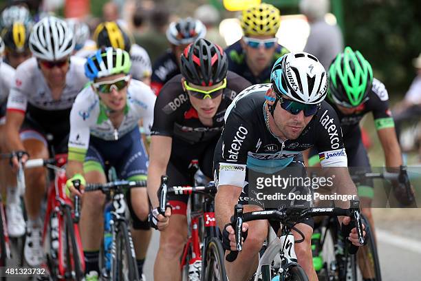 Mark Cavendish of Great Britain riding for Etixx-QuickStep takes a turn on the front of the group at the back of the race as they finished more than...