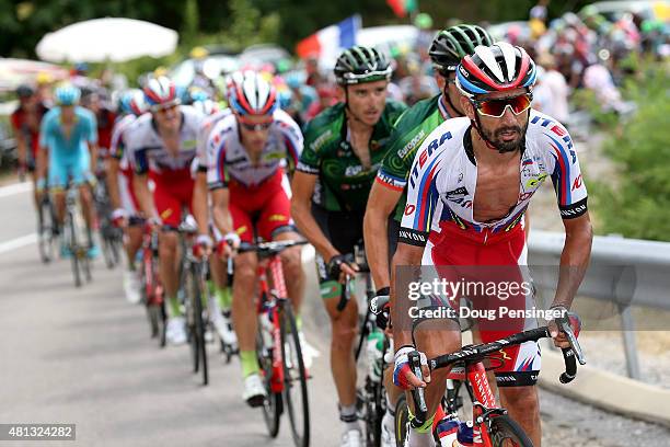 Giampaolo Caruso of Italy riding for Team Katusha rides at the front of the peloton as they pursue the breakaway on the Col de l'Escrinet during...