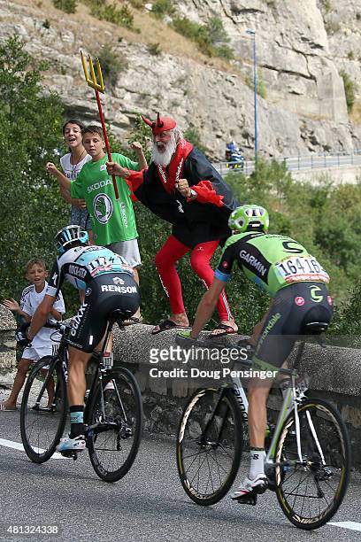 Dieter "Didi" Senft El Diablo of the Tour de France cheers on Matteo Trentin of Italy riding for Etixx-QuickStep and Ryder Hesjedal of Canada riding...