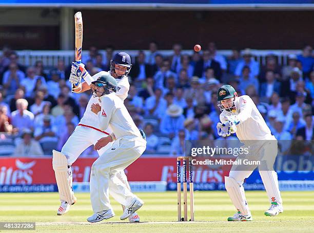 Stuart Broad of England plays a shot as Steve Smith of Australia takes evasive action during day four of the 2nd Investec Ashes Test match between...