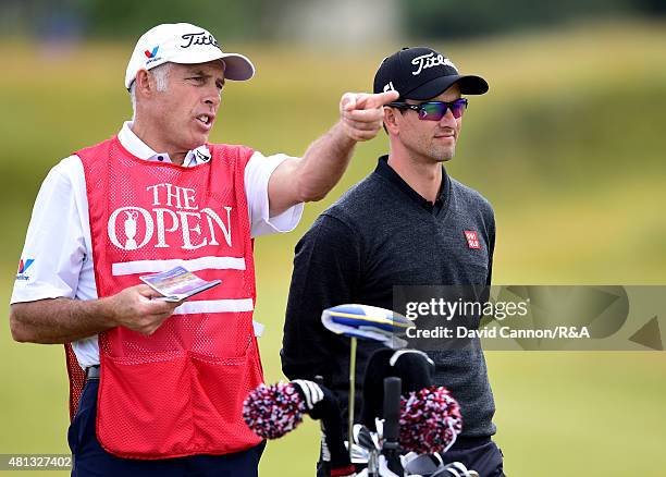 Adam Scott of Australia waits on the fifth fairway with caddie Steve Williams during the third round of the 144th Open Championship at The Old Course...