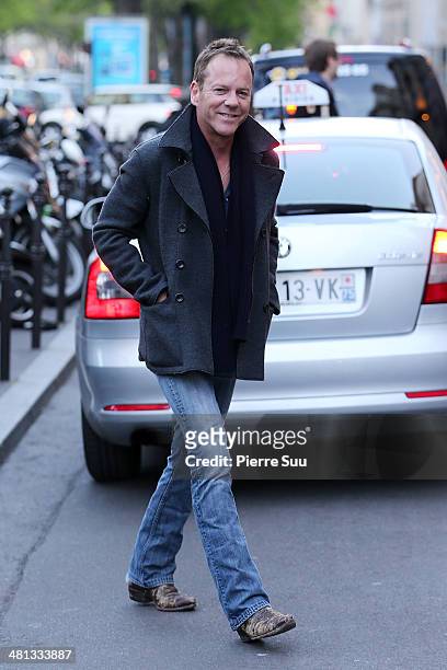 Kiefer Sutherland with his girlfriend and her daughter on vacation on March 29, 2014 in Paris, France.