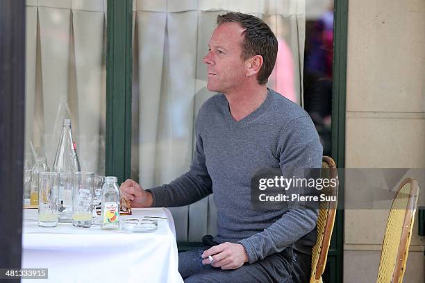 Kiefer Sutherland with his girlfriend and her daughter on vacation on March 29, 2014 in Paris, France.