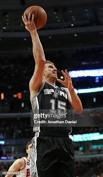 Matt Bonner of the San Antonio Spurs shoots against the Chicago Bulls at the United Center on March 11, 2014 in Chicago, Illinois. The Spurs defeated...