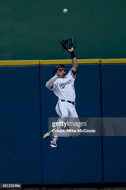 Carlos Gomez of the Milwaukee Brewers misses this leaping catch at the wall in centerfield allowing Jaff Decker of the Pittsburgh Pirates a triple...