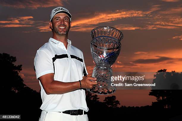 Scott Piercy of the United States poses with the trophy after winning the Barbasol Championship at the Robert Trent Jones Golf Trail at Grand...