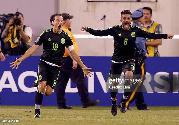 Andres Guardado of Mexico celebrates his goal with teammate Jonathan do Santos in the final minute of overtime against Costa Rica during the...