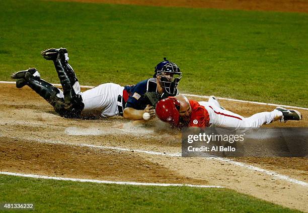 Thomas Murphy of the USA drops the ball as Peter Orr of Canada scores the winning run in the tenth inning making the score 7-6 during their Gold...
